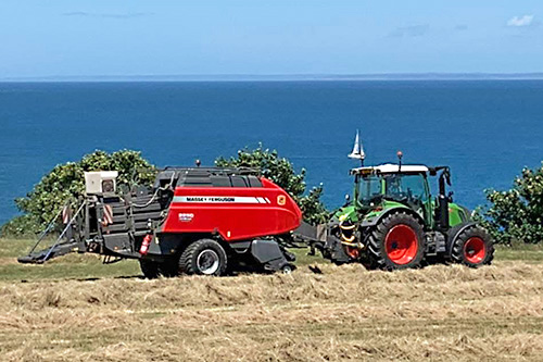 baler with additive applicator mounted on it