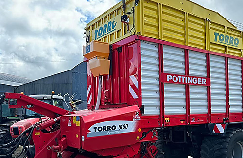Powdermaster dry additive applicator on a forage wagon