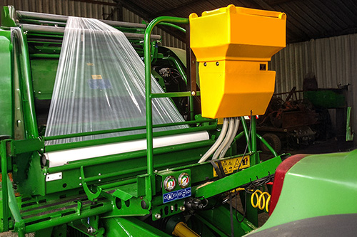 Powdermaster dry preservatives applicator on a forage wagon