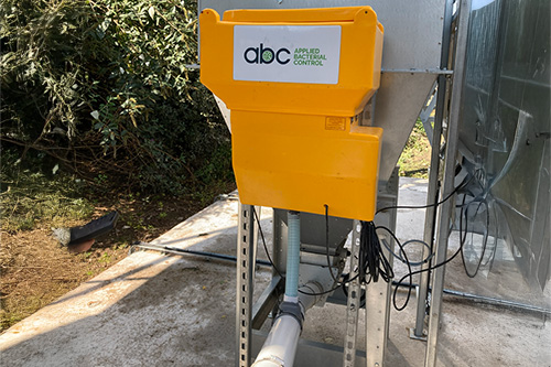 Powder applicator set up on poultry feed silo