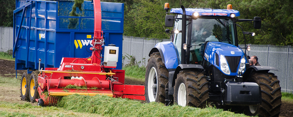Additive applicators on a trailed forage harvesters